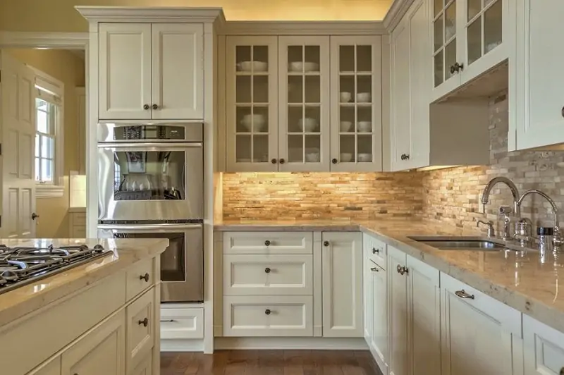 stone backsplash for kitchen with white cabinets