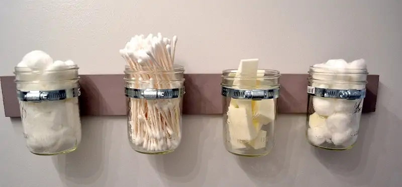 wall mounted storage with mason jars for the bathroom