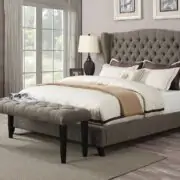 . Contrast with tufted headboard