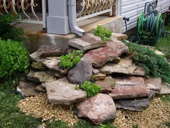 gutter drain ideas stone waterfall