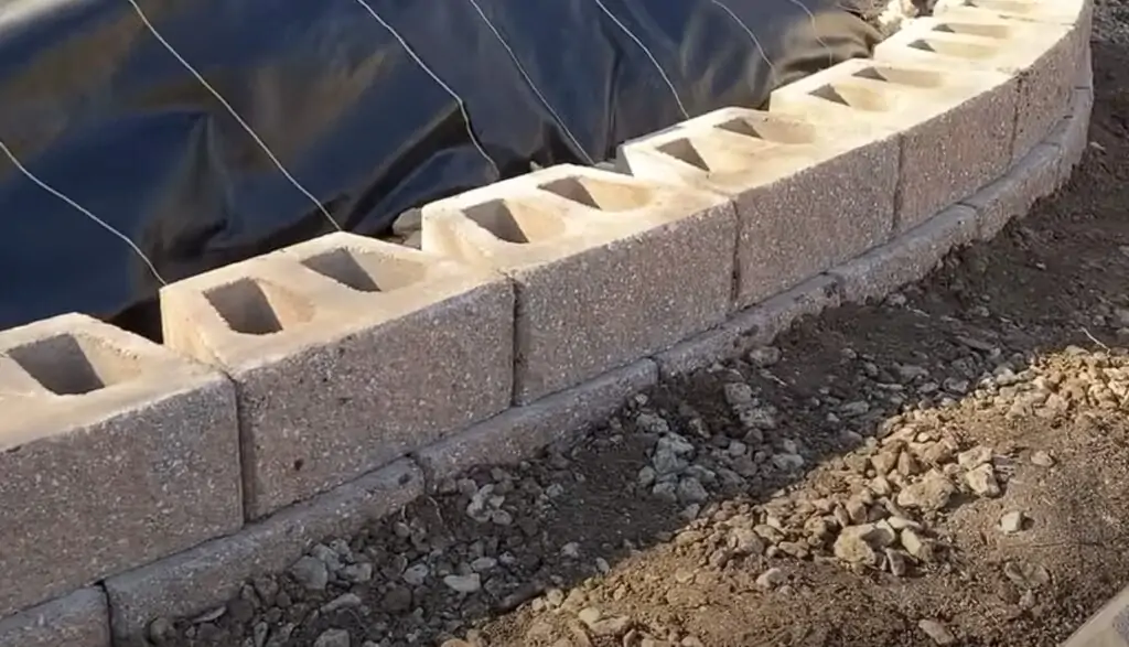 second layer of blocks of retaining wall