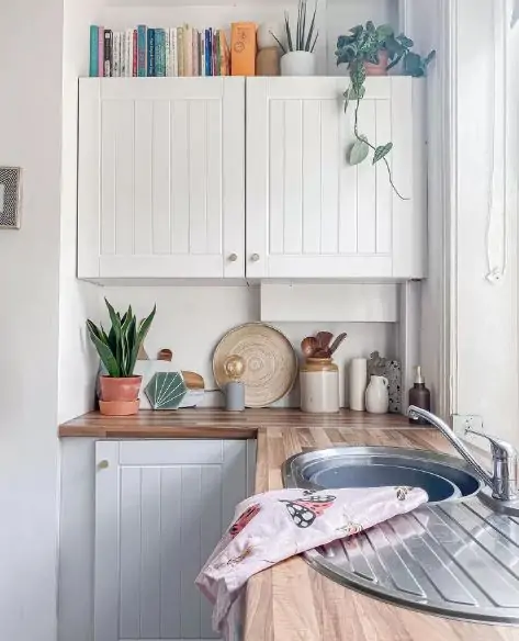 cookbooks above the kitchen cabinets