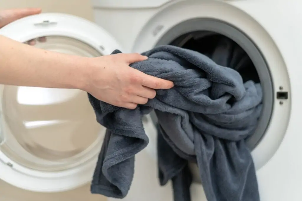 loading weighted blanket into washing machine