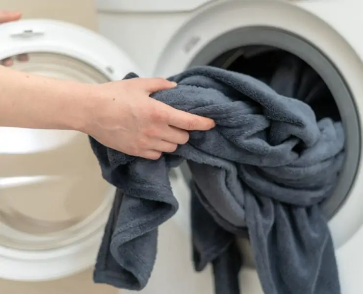 loading weighted blanket into washing machine