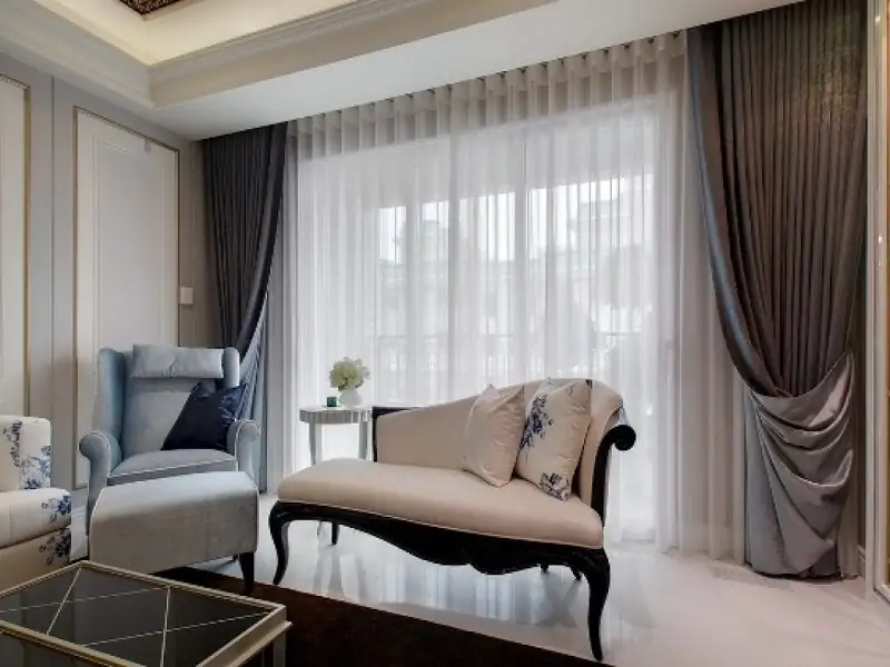 layer sheer curtains and thick drapes in living room