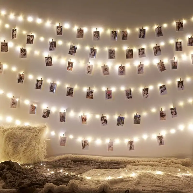 peg and string lights to create wall collage