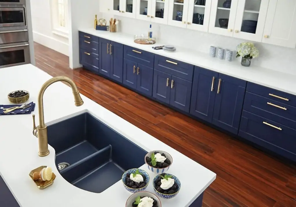 Blue white gold kitchen with wood floor