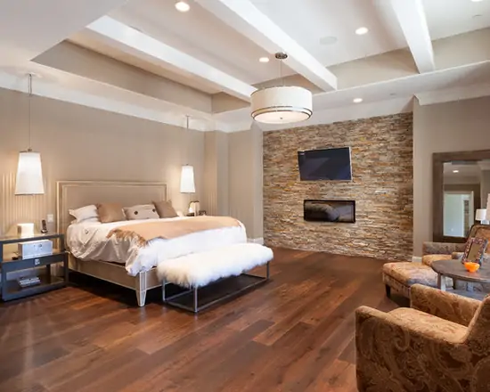 luxury master bedroom with sitting area with tv from one side of bed