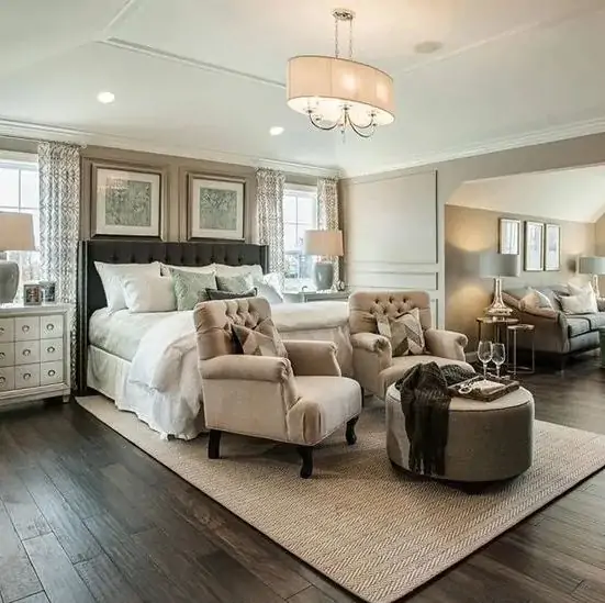 Large master bedroom with sitting area at the foot of the bed