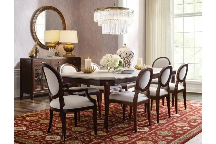 Mirror shape and frame matching the chairs in a modern dining room