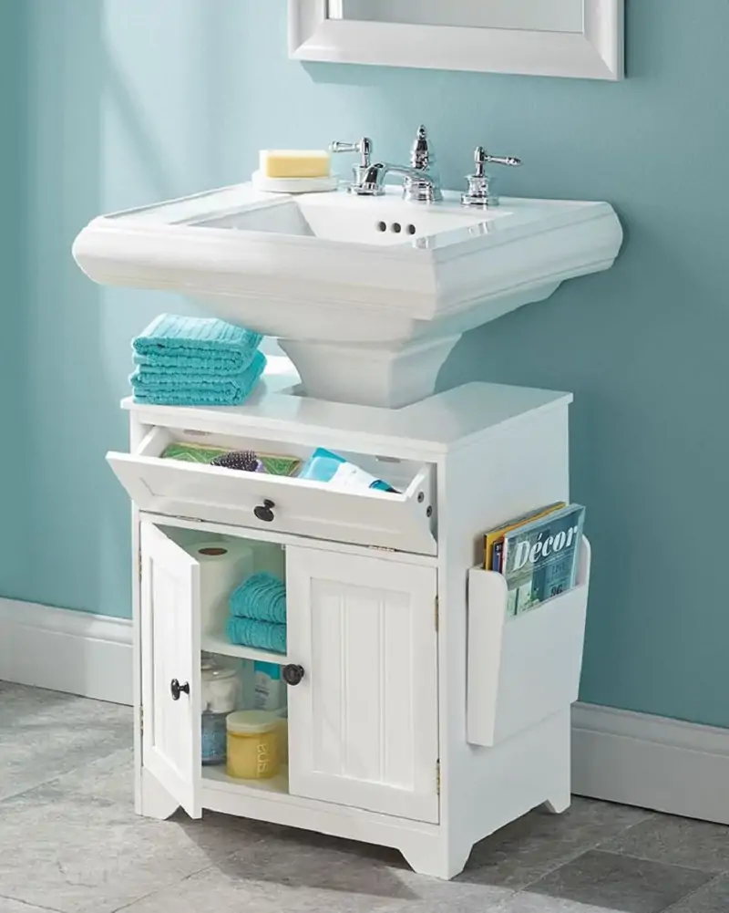 . Add a Cabinet Near the Pedestal Sink
