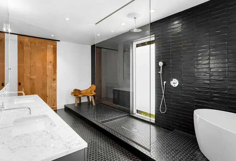 dramatic black tiles for walk in shower