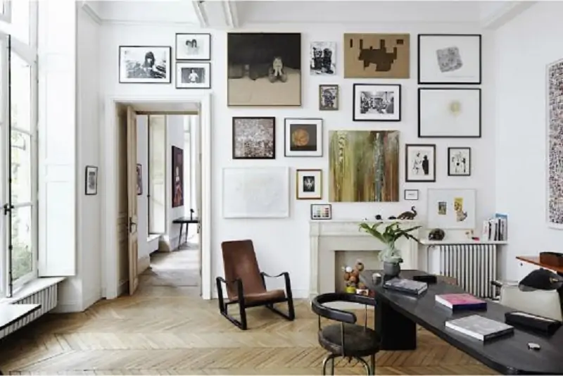 Multiple artworks on living room walls